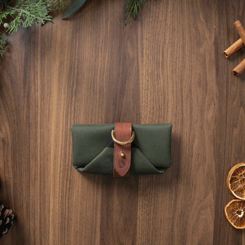 Ruff & Tumble Foldable Travel Bowl in Olive folded for travel