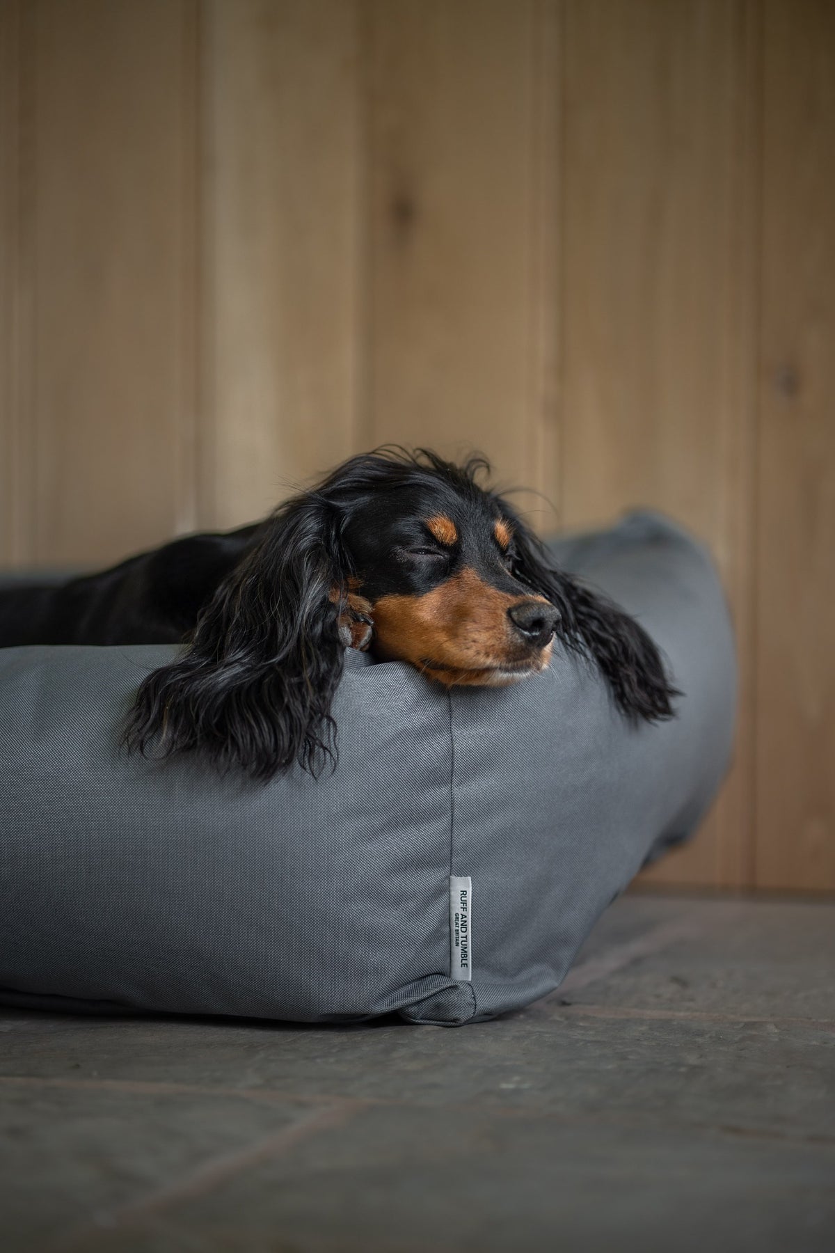 Ruff & Tumble Waterproof Burnham Bolster Dog Bed in Storm with dog